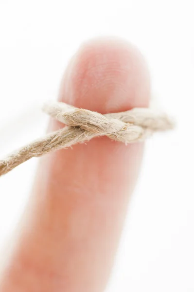 Finger with string tied around — Stock Photo, Image
