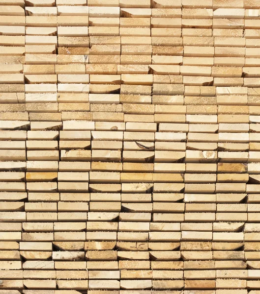 Background of a stack Of Wooden Boards From Ends — Stock Photo, Image