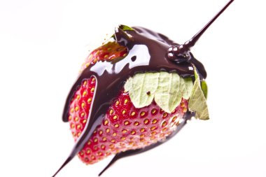 Chocolate Poured onto Strawberry clipart