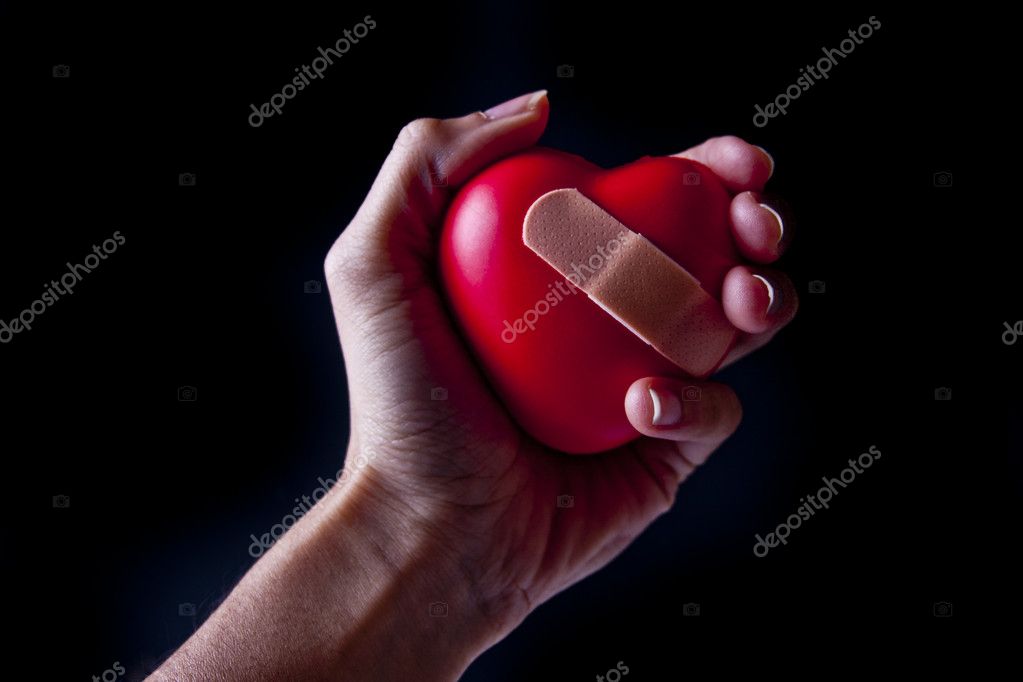 bandaged heart in hands