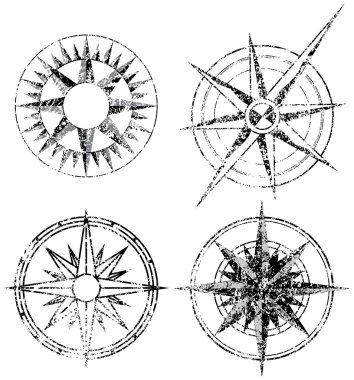 Four Grunge Compasses clipart