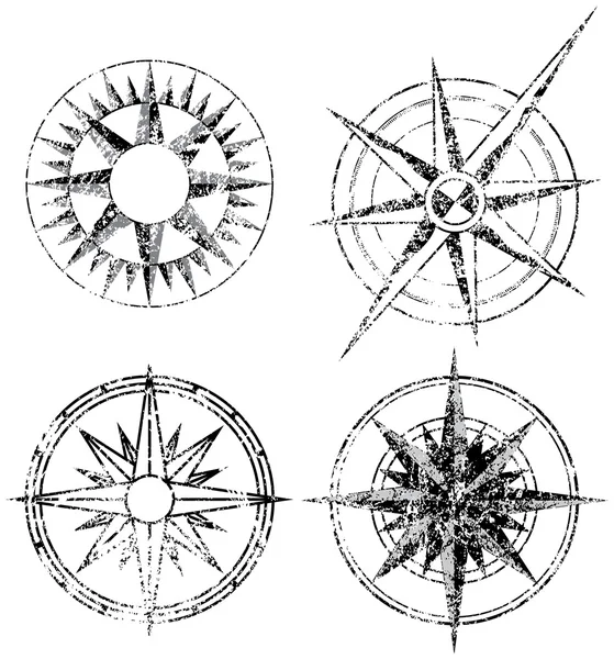 Чотири компаси гранж — стоковий вектор