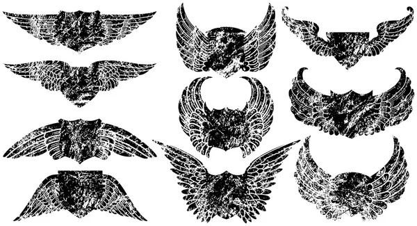 Grunge φτερωτό ασπίδες — Διανυσματικό Αρχείο
