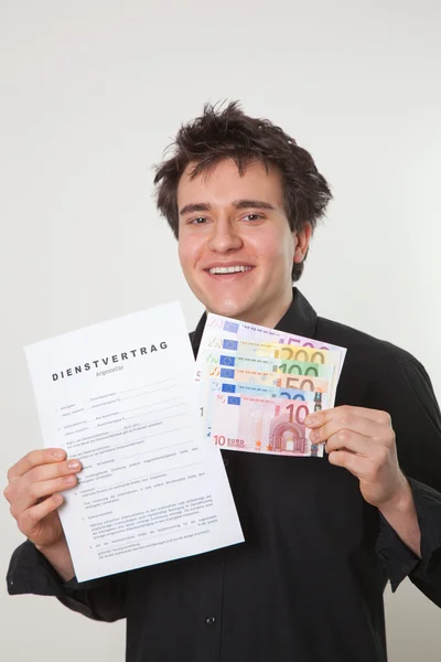 Young man with employment contract und banknotes — Stock Photo, Image