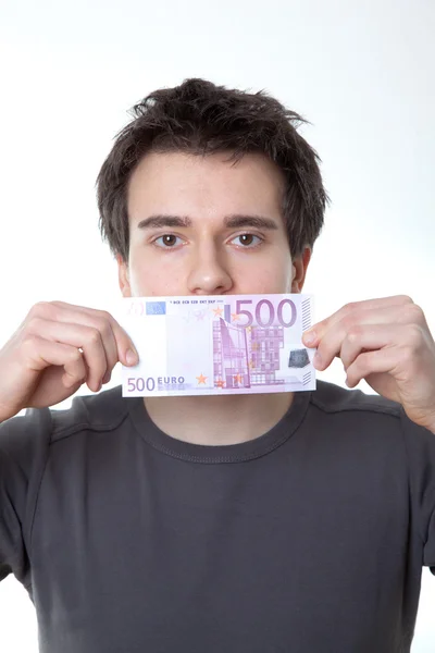Young man with a banknote on his mouth — Stock Photo, Image