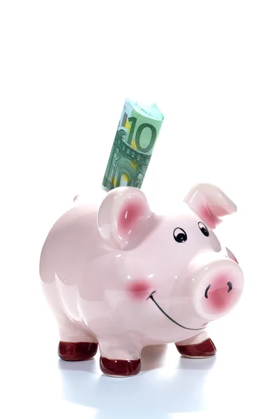 Banco porquinho com uma nota de 100 euros na ranhura — Fotografia de Stock