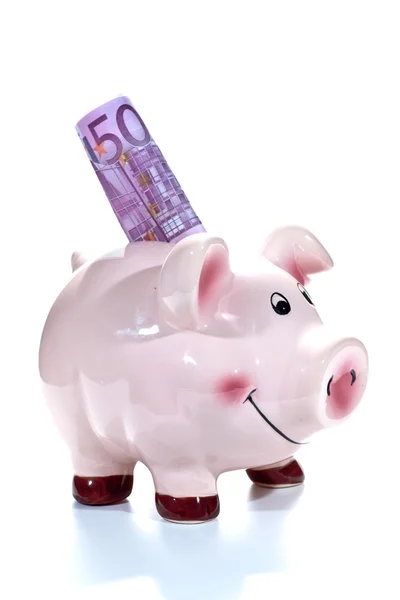 Piggy bank met een biljet van 500 euro in de sleuf Stockfoto