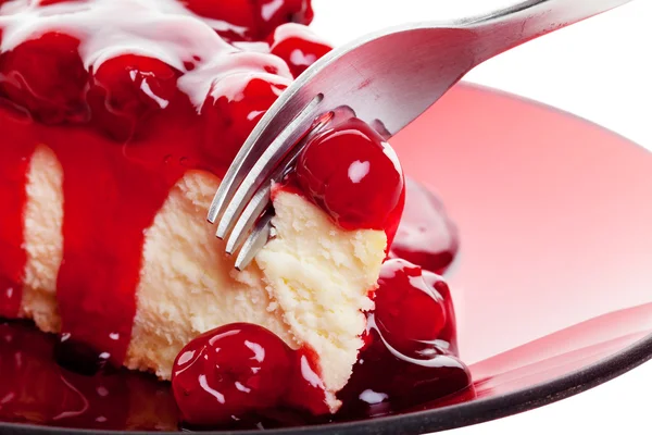 Cherry cheesecake met vork Stockfoto