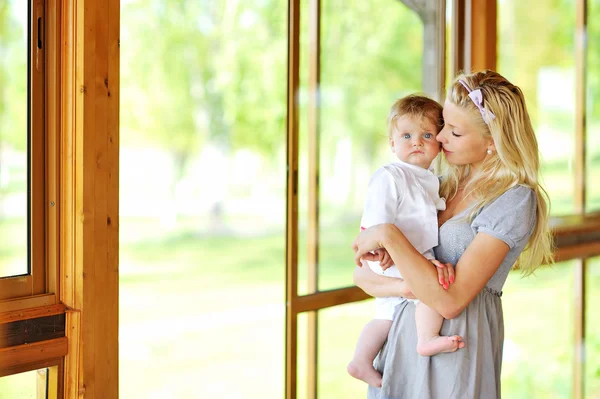 Young beautiful mother with her little child outdoors — Stock Photo, Image