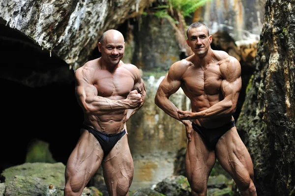 Two successful bodybuilder posing — Stock Photo, Image