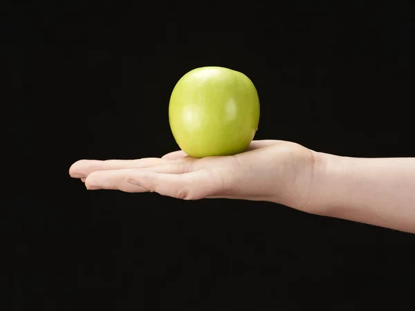 Childs hand with apple in palm — Stock Photo, Image