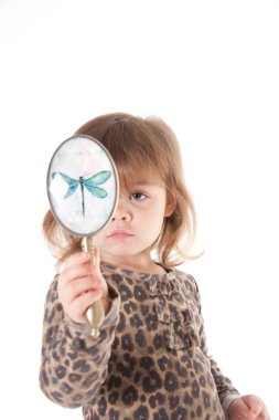 Child looking in a mirror clipart