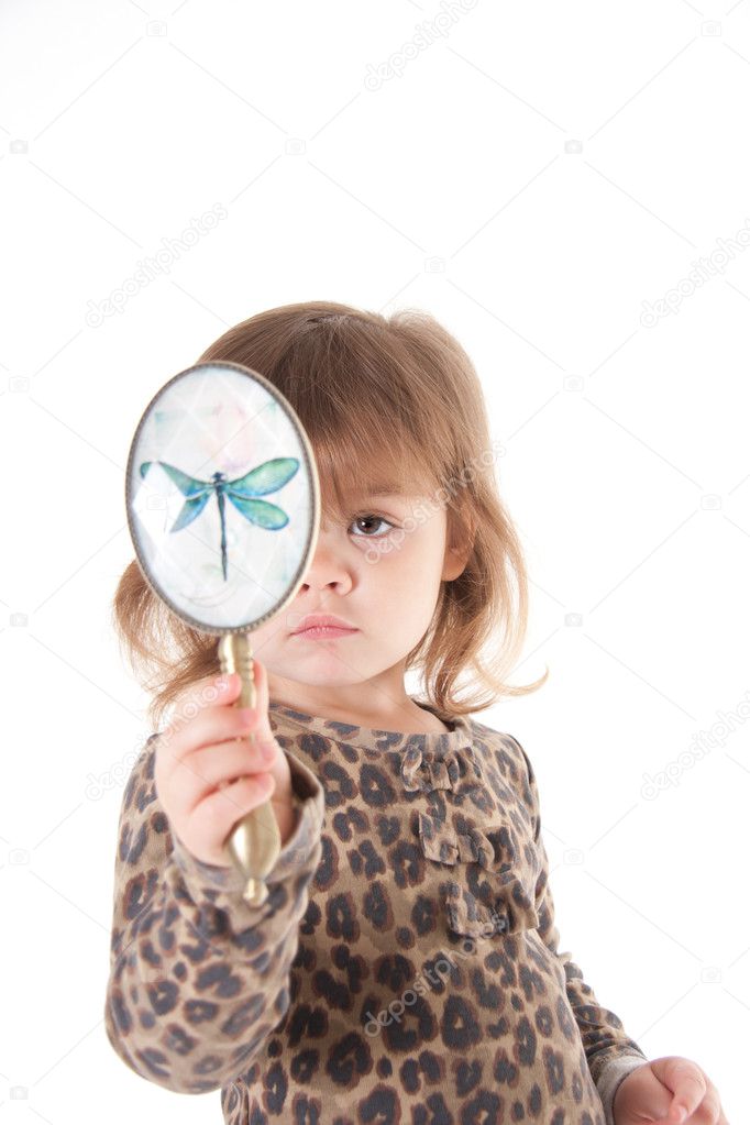 Child looking in a mirror