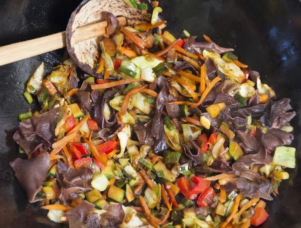 stock image Mixing food in wok