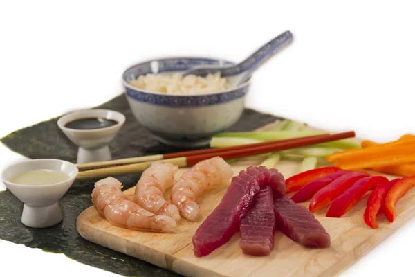 Sushi ingredients, soy sauce, wasabi with sake and served with chopsticks, — Stock Photo, Image