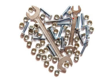 Assorted wrench,nuts and bolts heart on white background clipart