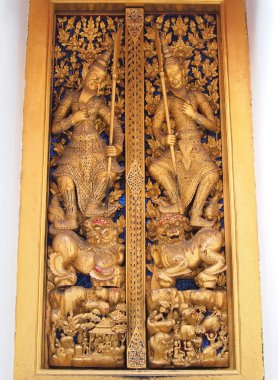 Thai molding art on door of the temple clipart