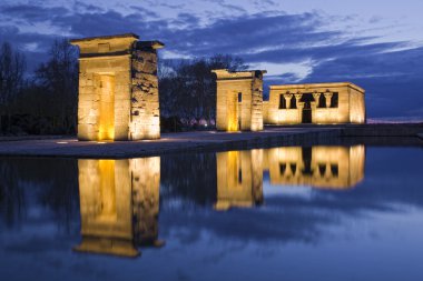 Egyptian temple reflection at night clipart