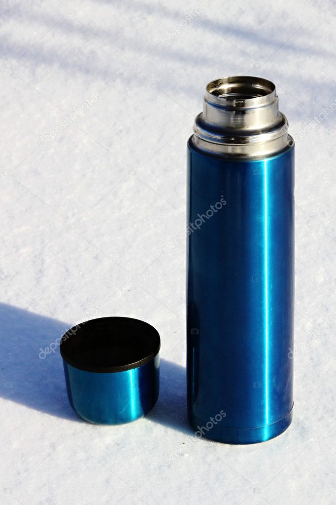 Blue thermos with a cup