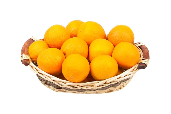 Stock image Oranges in a wicker basket isolated on white background