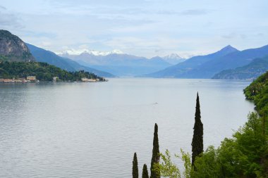 Como Lake landscape. Trees, water and mountains. Italy, Europe. clipart