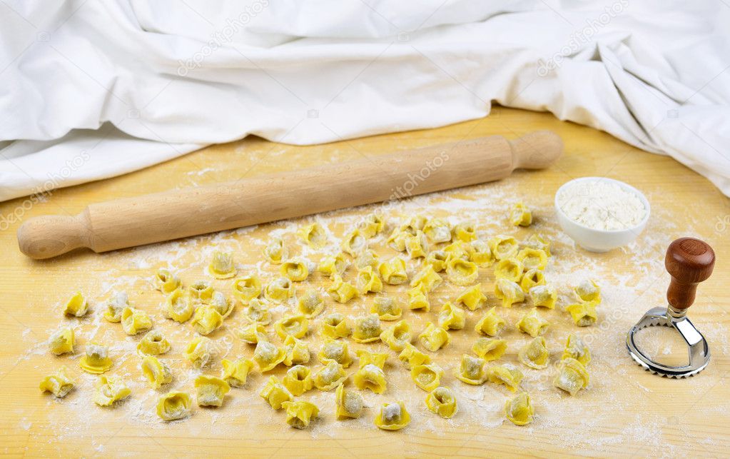 Tortellini italian pasta stuffed with flour and rolling pin