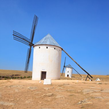 Two windmills. Castile La Mancha, Spain. clipart