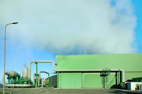 Geothermal energy. A steam coming out from a small green power p — Stock Photo, Image