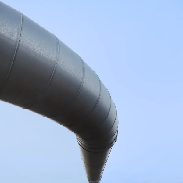 Curved industrial pipe line, sky background. Geothermal power pl — Stock Photo, Image