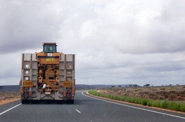 Oversize truck at the highway clipart