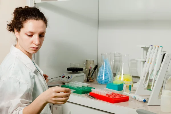 Female researcher with a test tube — Stock Photo, Image