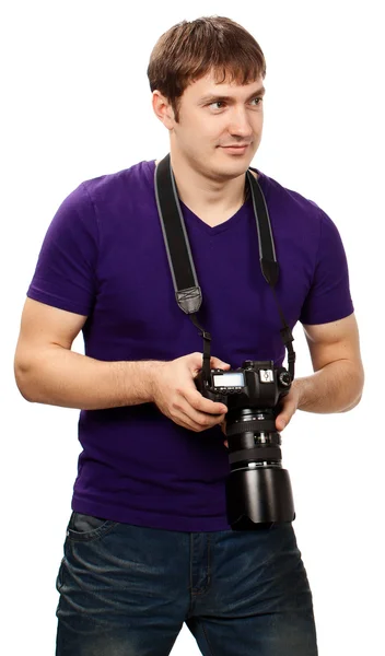 Männlicher Studiofotograf bei der Arbeit mit einer DSLR-Kamera, isoliert auf Weiß — Stockfoto
