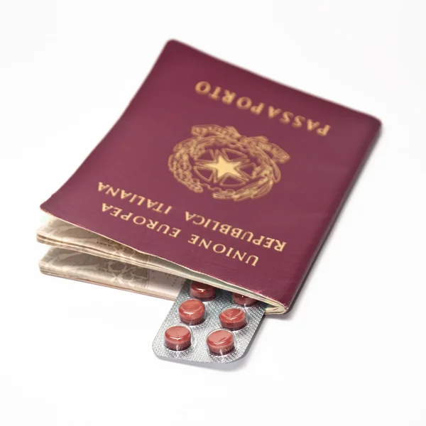 Pills inside a passport — Stock Photo, Image