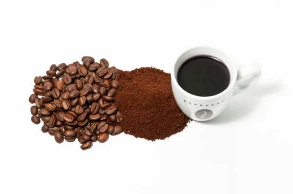 Espreso kaffekopp bönor och pulver Stockfoto