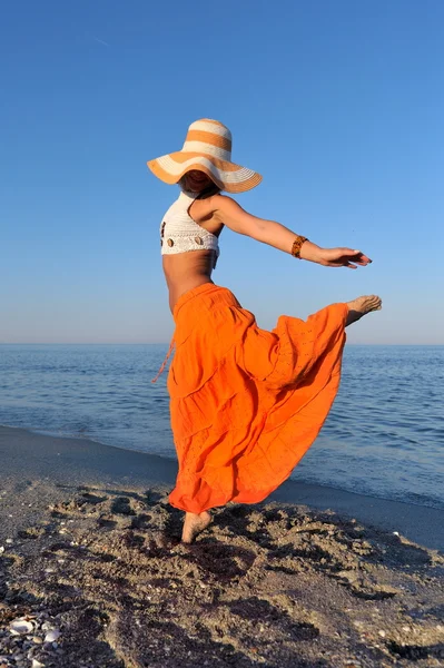 stock image Young woman on the beach in summer