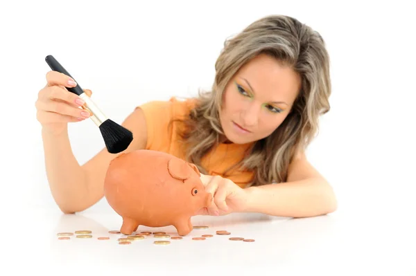 Young woman with in piggy bank against white — Stock Photo, Image