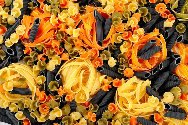 Colorful uncooked pasta — Stock Photo, Image