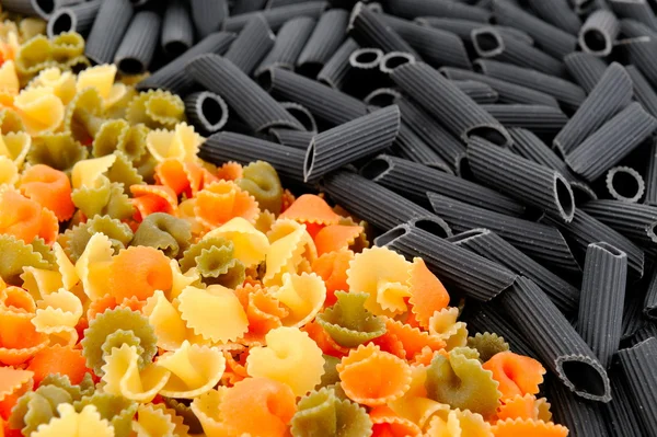 Stock image Colorful uncooked pasta - tagliatelle