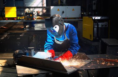 Welder in action clipart