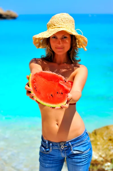 Young woman holding slice of watermelon — Stock Photo, Image