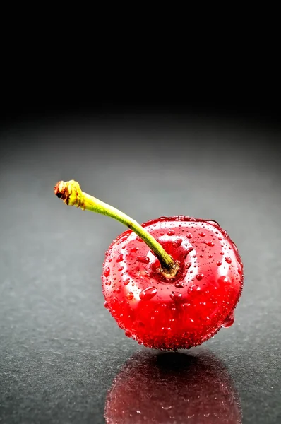 stock image Ripen cherries against black background