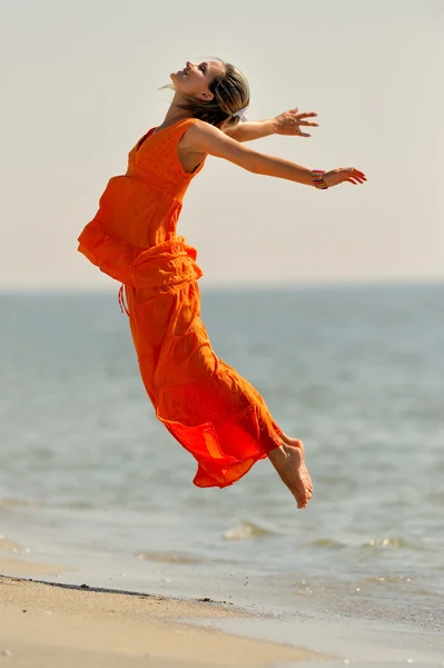 stock image Young woman on the beach