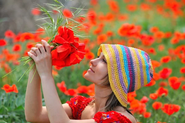 Young beautiful woman on flower field — Stock Photo, Image