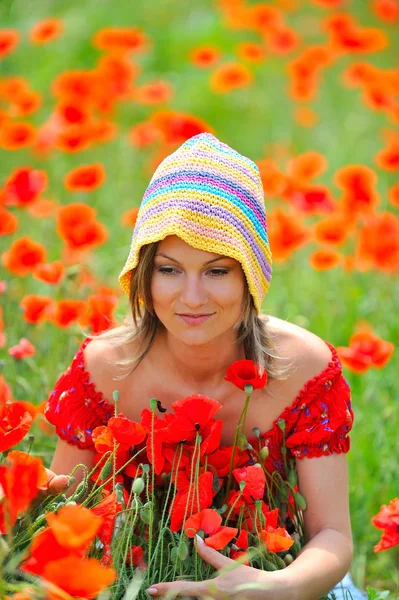 Young beautiful woman on flower field — Stock Photo, Image
