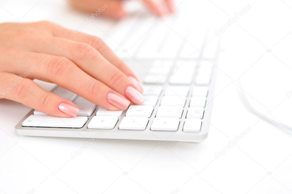 Closeup of woman hands typing