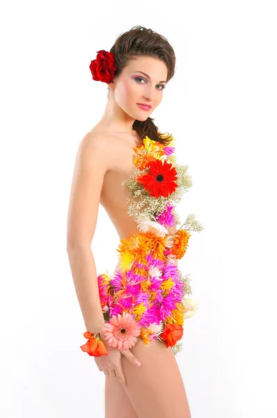 Beautiful young woman with spring flowers — Stock Photo, Image