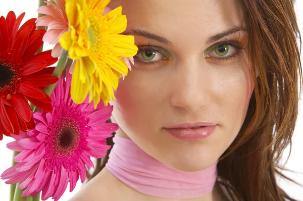 Beautiful young woman with flowers — Stock Photo, Image