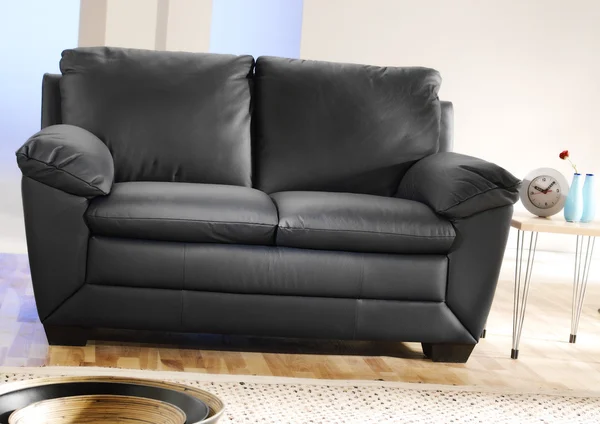 Modern black leather couch — Stock Photo, Image