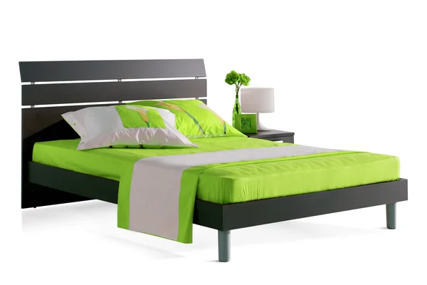 Зеленая кровать — стоковое фото