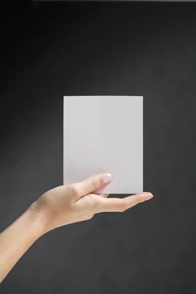 stock image Hands holding white card